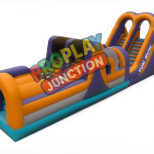 Inflatable obstacle course in orange and purple with archways, climbing wall and dual slide
